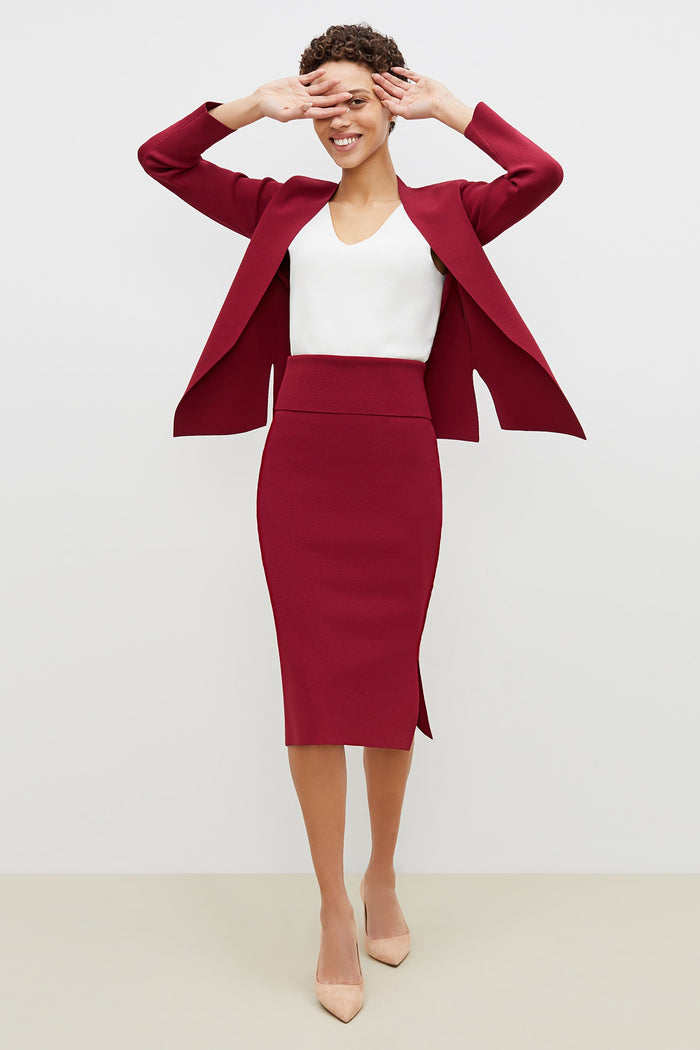 Front image of a woman standing wearing the harlem skirt in hibiscus | Grid | Exclude