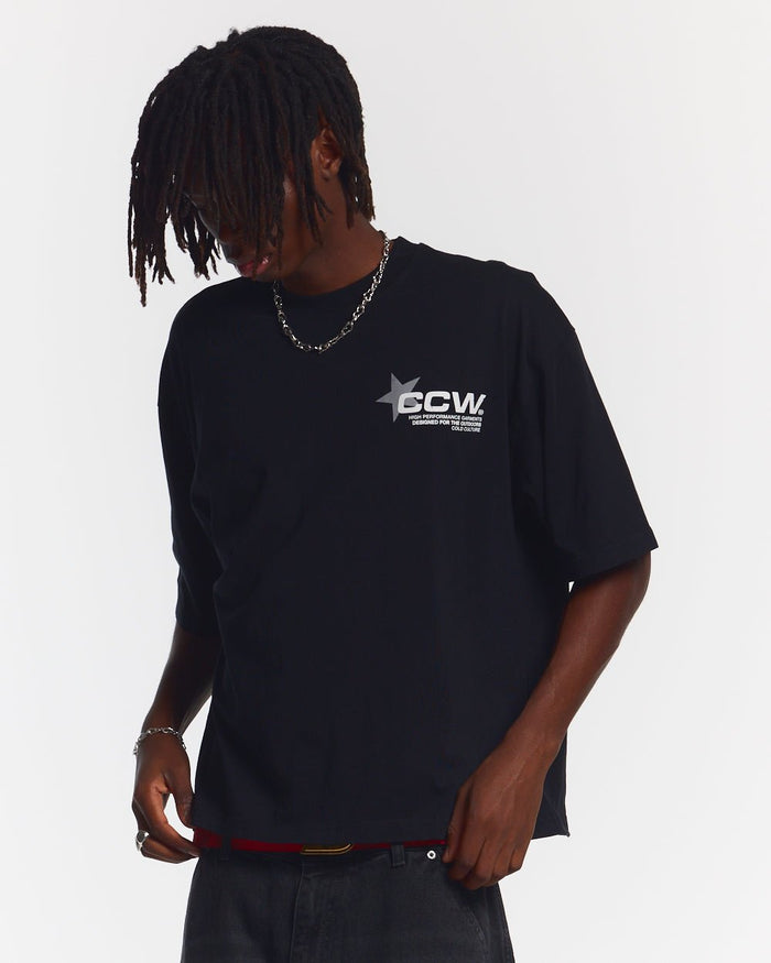 ASTRO TEE BLACK - black star print tee, front view on male model - Cold Culture #man