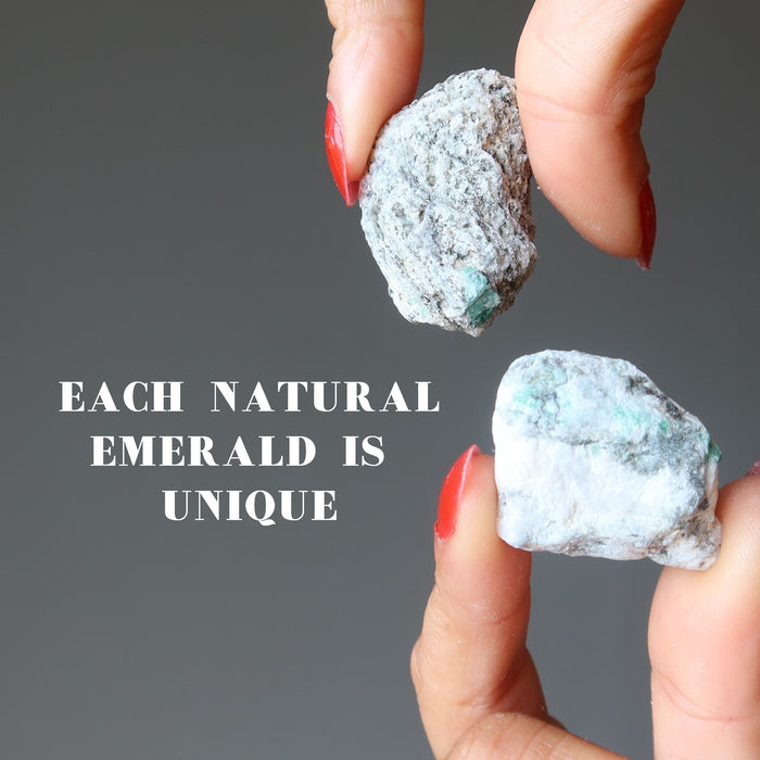 hand holding two raw Emerald Clusters each is unique