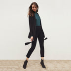 Front image of a woman standing wearing the Finley Legging—Ribbed Jardigan Knit in Black