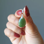 hand holding jade pendant