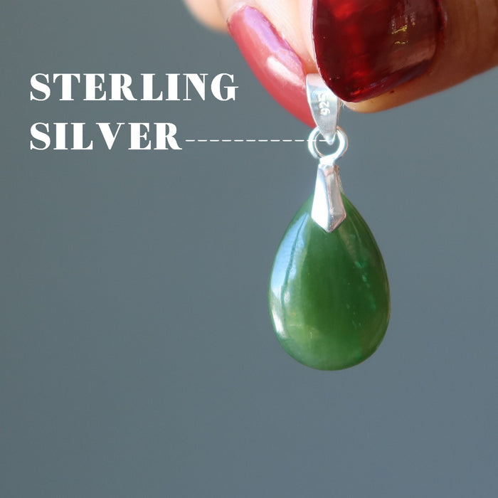 hand holding jade pendant