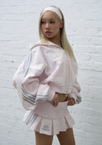 MALFUNCTION SPORTY PLEATED MINI SKIRT BABY PINK