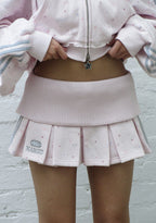 MALFUNCTION SPORTY PLEATED MINI SKIRT BABY PINK