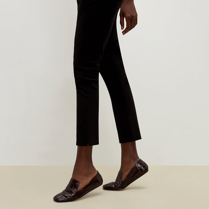 Detail image of a woman standing wearing the Marais pant in black