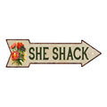 Vintage-style She Shack arrow metal sign with flowers, a rustic accent for she sheds and garden decor