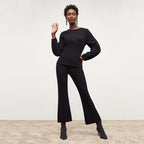 Front image of a woman standing wearing the Shiloh Pant in Black