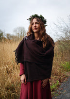 Irish-inspired maroon and black woven shawl with silver Trinity brooch for everyday folklore wear