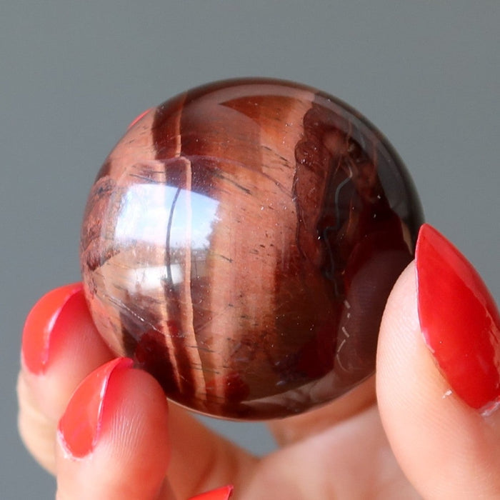 red tigers eye sphere